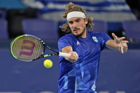 Stefanos Tsitsipas, of Greece, plays Frances Tiafoe, of the United States, during the second round of the tennis competition at the 2020 Summer Olympics, Tuesday, July 27, 2021, in Tokyo, Japan. (AP Photo/Seth Wenig)