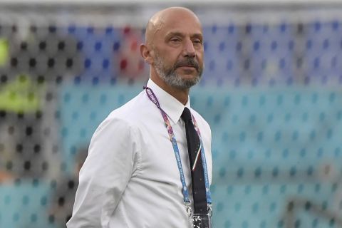 Gianluca Vialli, head of the Italian team delegation checks the field ahead of the Euro 2020 soccer championship group A match between Italy and Turkey at the Olympic stadium in Rome, Friday, June 11, 2021. (Alberto Lingria/Pool Photo via AP)