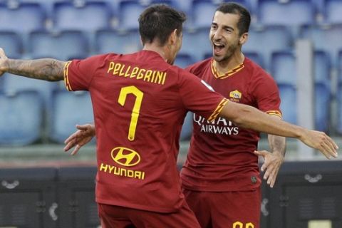 Roma's Henrikh Mkhitaryan, right, celebrates with his teammate Roma's Lorenzo Pellegrini after scoring during a Serie A soccer match between Roma and Sassuolo, in Rome, Sunday, Sept. 15, 2019. (AP Photo/Gregorio Borgia)