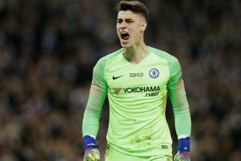 Chelsea goalkeeper Kepa Arrizabalaga reacts after stops a shot from Manchester City's Leroy Sane during a penalty shootout at the end of the English League Cup final soccer match between Chelsea and Manchester City at Wembley stadium in London, England, Sunday, Feb. 24, 2019. (AP Photo/Tim Ireland)