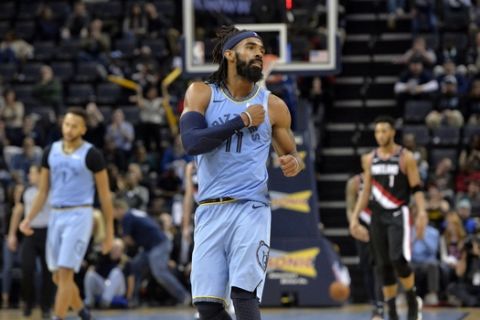 Memphis Grizzlies guard Mike Conley (11) gestures in the second half of an NBA basketball game against the Portland Trail Blazers on Wednesday, Dec. 12, 2018, in Memphis, Tenn. (AP Photo/Brandon Dill)