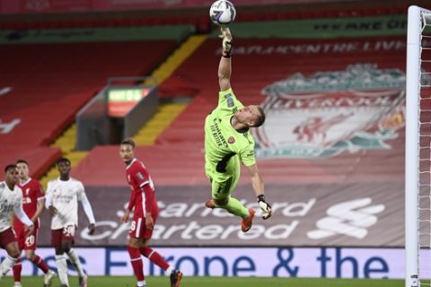 Arsenal's goalkeeper Bernd Leno makes a save during the English League Cup fourth round soccer match between Liverpool and Arsenal at Anfield, Liverpool, England, Thursday, Oct. 1, 2020. (Laurence Griffiths/Pool via AP)