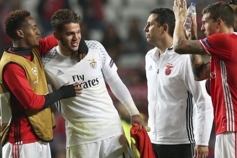 Benfica goalkeeper Ederson, 2nd left, celebrates with his teammates at the end of the Champions League group B soccer match between Benfica and Dynamo Kiev at the Luz stadium in Lisbon, Tuesday, Nov. 1, 2016. Benfica won 1-0. (AP Photo/Steven Governo)