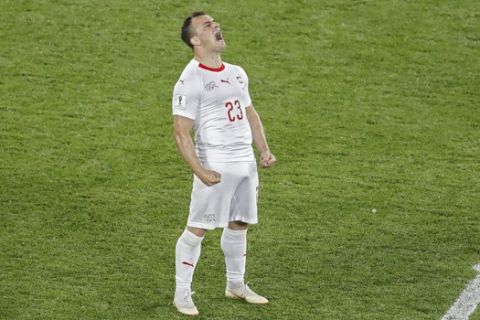 Switzerland's Xherdan Shaqiri celebrates after scoring his side's second goal during the group E match between Switzerland and Serbia at the 2018 soccer World Cup in the Kaliningrad Stadium in Kaliningrad, Russia, Friday, June 22, 2018. Shaqiri scored once in Switzerland's 2-1 victory. (AP Photo/Antonio Calanni)