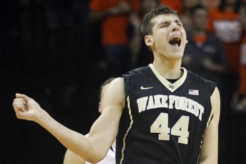 Wake Forest forward Konstantinos Mitoglou (44) celebrates making a shot during the second half of an NCAA college basketball game at John Paul Jones Arena in Charlottesville, Va., on Saturday, Feb. 14, 2015. Virginia defeated Wake Forest 61-60. (AP Photo/Ryan M. Kelly)