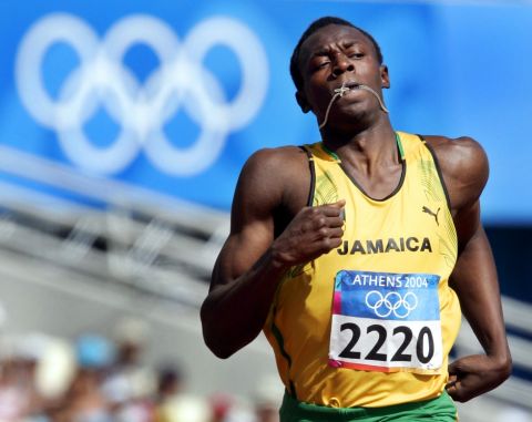 Jamaica's Usain Bolt runs  in a men's 200 meter qualifying heat at the Olympic Stadium during the 2004 Olympic Games in Athens, Tuesday, Aug. 24  2004. (AP Photo/Anja Niedringhaus)