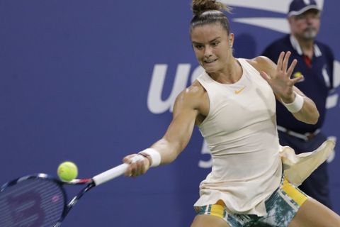 Maria Sakkari, of Greece, hits a forehand to Sofia Kenin, of the United States, during the second round of the U.S. Open tennis tournament Wednesday, Aug. 29, 2018, in New York. (AP Photo/Jason DeCrow)
