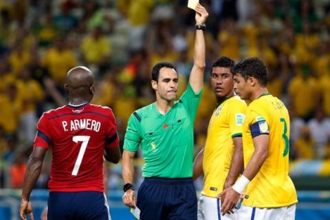 FORTALEZA, BRAZIL - JULY 04: Thiago Silva of Brazil is shown a yellow card by referee Carlos Velasco Carballo during the 2014 FIFA World Cup Brazil Quarter Final match between Brazil and Colombia at Castelao on July 4, 2014 in Fortaleza, Brazil.  (Photo by Gabriel Rossi/Getty Images)