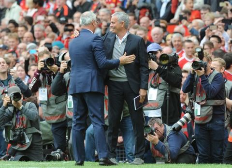 Leicester manager Claudio Ranieri, left, and Manchester United manager Jose Mourinho greet each other during the English Premier League soccer match between Manchester United and Leicester City at Old Trafford in Manchester, England, Saturday, Sept. 24, 2016. (AP Photo/Rui Vieira)

