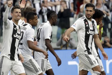 Juventus players celebrate after their teammate Federico Bernardeschi scored their side's second goal during a Serie A soccer match between Juventus and AC Fiorentina, at the Allianz stadium in Turin, Italy, Saturday, April 20, 2019. Juventus needs a draw against visiting Fiorentina to clinch a record-extending eighth straight Serie A title. (AP Photo/Luca Bruno)