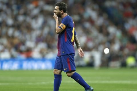 Barcelona's Lionel Messi walks along the pitch during the Spanish Super Cup second leg soccer match between Real Madrid and Barcelona at the Santiago Bernabeu Stadium in Madrid, Wednesday, Aug. 16, 2017. Real Madrid won 5-1 on aggregate. (AP Photo/Francisco Seco)