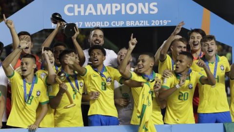 Brazilian players celebrate after their team's 2-1 victory over Mexico at the end of FIFA U-17 World Cup Brazil 2019 soccer match at Arena Bezerrao in Brasilia, Brazil, Sunday, Nov. 17, 2019. (AP Photo/Eraldo Peres)