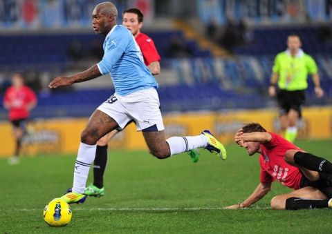 Lazio's French forward Djibril Cisse (L) controls the ball during the Italian serie A football match Lazio vs Novara at Olympic stadium in Rome on December 5, 2011. AFP PHOTO / ALBERTO PIZZOLI (Photo credit should read ALBERTO PIZZOLI/AFP/Getty Images)