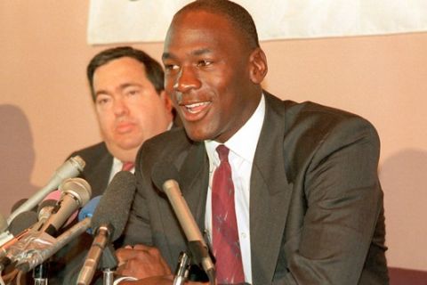 Michael Jordan of the Chicago Bulls speaks at a news conference after he signed an eight-year extension to his contract in Chicago, Ill., Tuesday, Sept. 20, 1988.     At left is Bulls General Manager Jerry Kraus.  (AP Photo/Mark Elias)