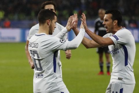 Chelsea's Pedro, right congratulates Chelsea's Eden Hazard as he celebrates after scoring the opening goal of the game from the penalty spot during their Champions League, group C, soccer match between Qarabag FK and Chelsea at the Baku Olympic stadium in Baku, Azerbaijan, Wednesday, Nov. 22, 2017. (AP Photo/Pavel Golovkin)