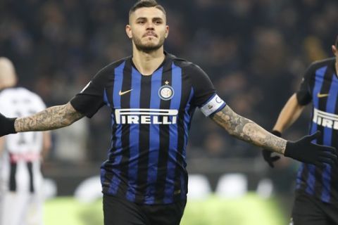 Inter Milan's Mauro Icardi celebrates after scoring his team's first goal on a penalty kick during an Italian Serie A soccer match between Inter Milan and Udinese, at the San Siro stadium in Milan, Italy, Saturday, Dec. 15, 2018. (AP Photo/Antonio Calanni)