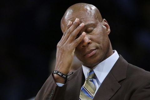 FILE - In this March 4, 2016, file photo, Los Angeles Lakers coach Byron Scott wipes his forehead during the second half of the Lakers' NBA basketball game against the Atlanta Hawks in Los Angeles. Scott told ESPN in an interview broadcast May 4, 2016 that he was "shocked" the team fired him last week. (AP Photo/Jae C. Hong, File)
