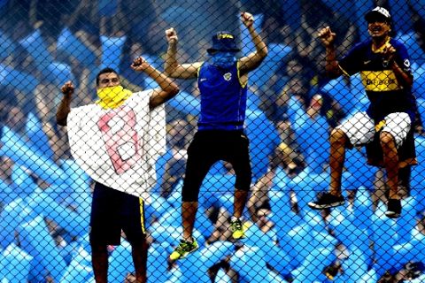 Fans of Argentina's Boca Juniors cheer during a Copa Libertadores first leg final soccer match against Argentina's River Plate in Buenos AIres, Argentina, Sunday, Nov. 11, 2018. (AP Photo/Natacha Pisarenko)