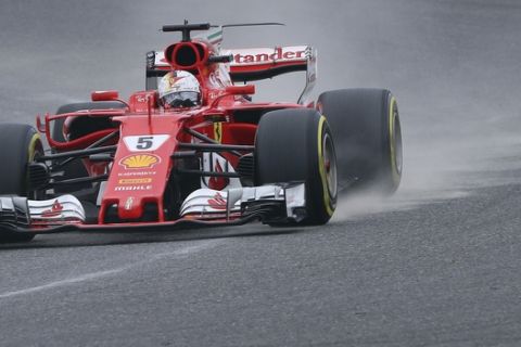 Ferrari driver Sebastian Vettel of Germany drives his car during the qualifying for the Japanese Formula One Grand Prix at Suzuka Circuit in Suzuka, central Japan, Saturday, Oct. 7, 2017. (AP Photo/Eugene Hoshiko)