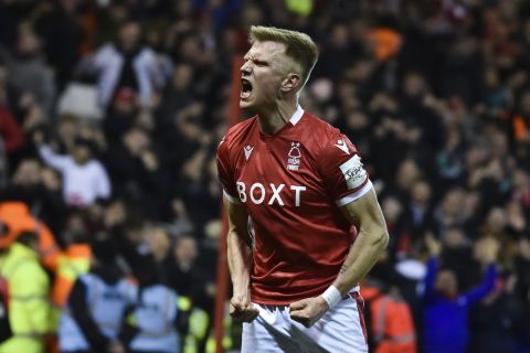 Nottingham Forest's Sam Surridge celebrates after scoring his team's first goal during the English FA Cup fifth round soccer match between Nottingham Forest and Huddersfield Town, at the City Ground, in Nottingham, England, Monday, March 7, 2022. (AP Photo/Rui Vieira)