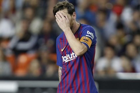 Barcelona forward Lionel Messi reacts after failing to score against Valencia during the Spanish La Liga soccer match between Valencia and Barcelona, at the Mestalla stadium in Valencia, Spain, Sunday, Oct. 7, 2018. (AP Photo/Alberto Saiz)