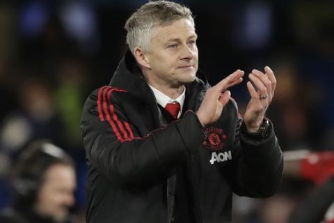 Manchester United caretaker head coach Ole Gunnar Solskjaer applauds fans at the end of the English FA Cup fifth round soccer match between Chelsea and Manchester United at Stamford Bridge stadium in London, Monday, Feb. 18, 2019. Manchester United won 2-0. (AP Photo/Matt Dunham)