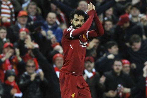 Liverpool's Mohamed Salah celebrates after scoring his side's opening goal during the Champions League semifinal, first leg, soccer match between Liverpool and Roma at Anfield Stadium, Liverpool, England, Tuesday, April 24, 2018. (AP Photo/Rui Vieira)