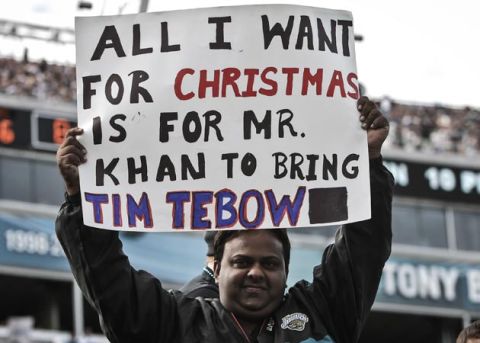December 23, 2012; Jacksonville, FL, USA; A Jacksonville fan holds up a sign referencing trading New York Jets quarterback Tim Tebow (not pictured) to the Jaguars during the second half of the game against the New England Patriots at EverBank Field. The Patriots defeated the Jaguars 23-16. Mandatory Credit: Rob Foldy-USA TODAY Sports
