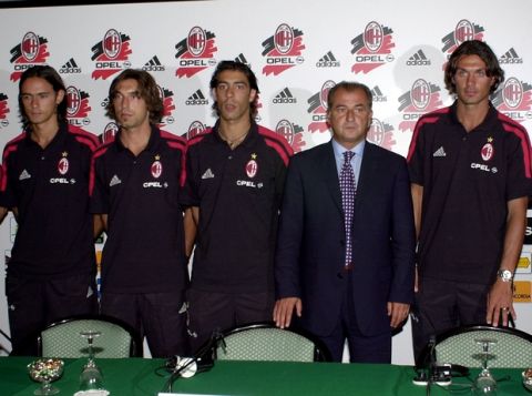 From left, AC Milan soccer club new players Filippo Inzaghi,  Andrea Pirlo and Portuguese soccer star Manuel Rui Costa, pose with new coach Fatih Terim of Turkey  and captain Paolo Maldini, at right,  during the teams's official presentation for the 2001/2002 season at the Gallia Hotel  in downtown Milan, Italy, Monday, July 16, 2001.  (AP Photo/Antonio Calanni)