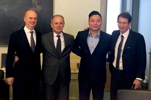 From left, AC Milan designated CEO Marco Fassone, Fininvest CEO Danilo Pellegrino, David Han Li, and head of Fininvest's business development, Alessandro Franzosi, pose following the transfer of AC Milan soccer club, in Milan, Italy, Thursday, April 13, 2017.  The takeover of AC Milan was completed Thursday, with Silvio Berlusconi selling the club to a Chinese consortium after 31 years in charge. The group, led by Chinese businessman Yonghong Li, has been attempting to buy Milan for some time but the deal has hit a series of delays and the sale has been postponed twice. (Fininvest Press Office via AP)