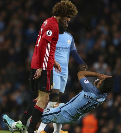 Manchester City's Sergio Aguero clashed with Manchester United's Marouane Fellaini, left, during the English Premier League soccer match between Manchester City and Manchester United at the Etihad Stadium in Manchester, England,Thursday, April 27, 2017.(AP Photo/Dave Thompson)