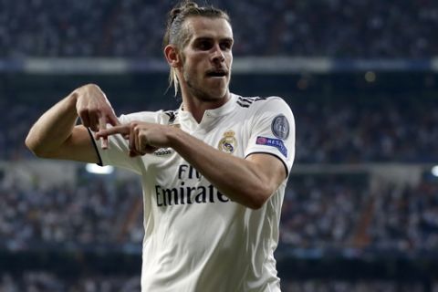 Real midfielder Gareth Bale celebrates after scoring his side's second goal during a Group G Champions League soccer match between Real Madrid and Roma at the Santiago Bernabeu stadium in Madrid, Spain, Wednesday Sept. 19, 2018. (AP Photo/Manu Fernandez)