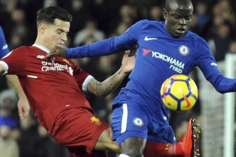 Liverpool's Philippe Coutinho, left, and Chelsea's Ngolo Kante battle for the ball during the English Premier League soccer match between Liverpool and Chelsea at Anfield, Liverpool, England, Saturday, Nov. 25, 2017. (AP Photo/Rui Vieira)