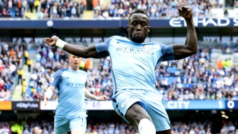 FILE- In this Saturday Aug. 13, 2016 file photo, Manchester City's Bacary Sagna, right, attempts to block a cross during the English Premier League soccer match between Manchester City and Sunderland at the Etihad Stadium in Manchester, England. Sagna has been charged by the English Football Association for questioning the impartiality of a referee in a Premier League game, the FA said Tuesday, Jan. 10, 2017.  (AP Photo/Jon Super, File)