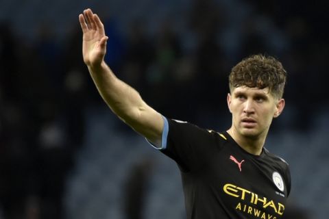 Manchester City's John Stones waves to supporters at the end of the English Premier League soccer match between Aston Villa and Manchester City at Villa Park in Birmingham, England, Sunday, Jan. 12, 2020. (AP Photo/Rui Vieira)