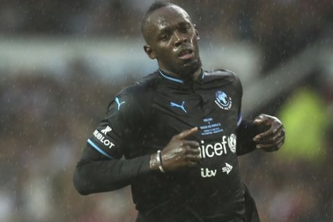 Former Olympic and Jamaican sprinter Usain Bolt in action on the pitch at Old Trafford as part of Unicef's Soccer Aid, Manchester, Sunday, June 10, 2018. (Photo by Joel C Ryan/Invision/AP)