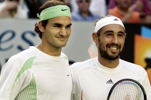 Switzerland's Roger Federer, left, and Cypriot Marcos Baghdatis pose for photographers prior to the start of the men's singles final at the Australian Open tennis tournament in Melbourne, Australia, Sunday, Jan. 29, 2006. (AP Photo/Mark Baker)