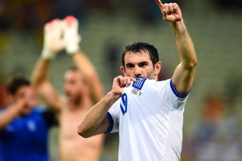 FORTALEZA, BRAZIL - JUNE 24: Giorgos Karagounis of Greece celebrates after defeating the Ivory Coast 2-1 during the 2014 FIFA World Cup Brazil Group C match between Greece and the Ivory Coast at Castelao on June 24, 2014 in Fortaleza, Brazil.  (Photo by Jamie McDonald/Getty Images)