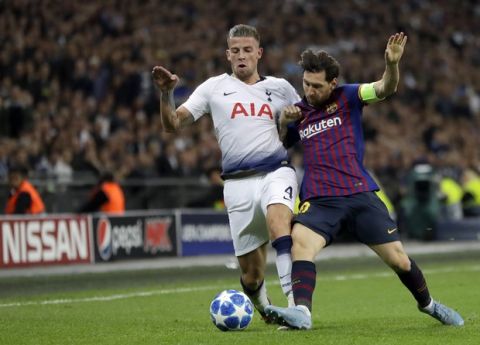 Barcelona forward Lionel Messi, right, duels for the ball with Tottenham defender Toby Alderweireld during the Champions League Group B soccer match between Tottenham Hotspur and Barcelona at Wembley Stadium in London, Wednesday, Oct. 3, 2018. (AP Photo/Kirsty Wigglesworth)