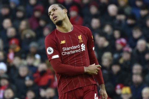 Liverpool's Virgil van Dijk during the English Premier League soccer match between Liverpool and Watford at Anfield stadium in Liverpool, England, Saturday, Dec. 14, 2019. (AP Photo/Rui Vieira)