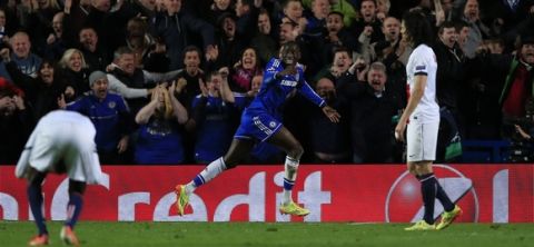 Chelsea's French-born Senegalese striker Demba Ba (C) celebrates scoring Chelsea's second goal during the UEFA Champions League quarter final second leg football match between Chelsea and Paris Saint-Germain at Stamford Bridge in London on April 8, 2014. Chelsea won 2-0 going through to the semi-final on the away goals rule. AFP PHOTO / ADRIAN DENNIS        (Photo credit should read ADRIAN DENNIS/AFP/Getty Images)