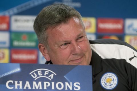 Leicester coach Craig Shakespeare gets up to leave a press conference at the Vicente Calderon stadium in Madrid, Spain Tuesday, April 11, 2017. Leicester will play Atletico Madrid Wednesday in a Champions League quarterfinal, first leg soccer match in Madrid. (AP Photo/Paul White)