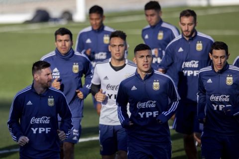 Argentina's national soccer players, including Lionel Messi left, during a training session in Madrid, Spain, Monday, March 18, 2019. Argentina will play a friendly soccer match against Venezuela on Friday.(AP Photo/Bernat Armangue)