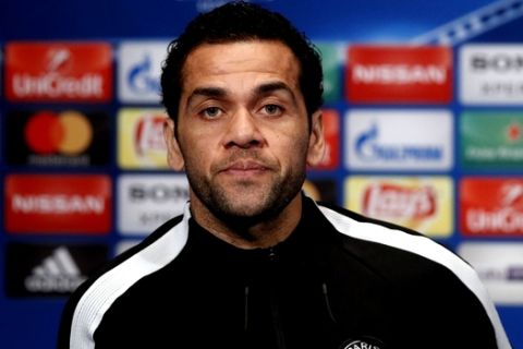 PSG's defender Dani Alves attends a press conference at the eve of the Champions League Round of 16 second leg soccer match between Paris Saint Germain and Real Madrid at the Parc des Princes stadium, in Paris, Monday, March. 5, 2018. (AP Photo/Francois Mori)