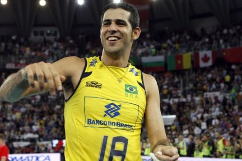 Brazil's Dante Guimaraes Amaral celebrates after winning the final match between Cuba and Brazil at the Men's Volleyball World Championships in Rome, Sunday, Oct. 10, 2010. Brazil won 3-1 and clinched the title. (AP Photo/Andrew Medichini)