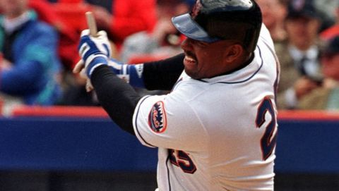New York Mets' Bobby Bonilla ends up with a stub of a broken bat as he hits an RBI single during the fifth inning of the Mets home opener against the Florida Marlins in New York Monday, April 12, 1999. The Mets defeated the Marlins 8-1. (AP Photo/Osamu Honda)