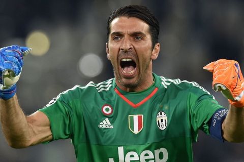 TURIN, ITALY - SEPTEMBER 30:  Gianluigi Buffon of Juventus celebrates after his team-mate Alvaro Morata scored the opening goal during the UEFA Champions League group E match between Juventus and Sevilla FC on September 30, 2015 in Turin, Italy.  (Photo by Valerio Pennicino/Getty Images)