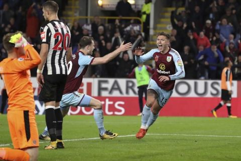 Burnley's Jeff Hendrick, right, celebrates scoring his side's first goal of the game with Ashley Barnes during the English Premier League soccer match Burnley versus Newcastle at Turf Moor, Burnley, England, Monday Oct. 30, 2017. (Martin Rickett/PA via AP)