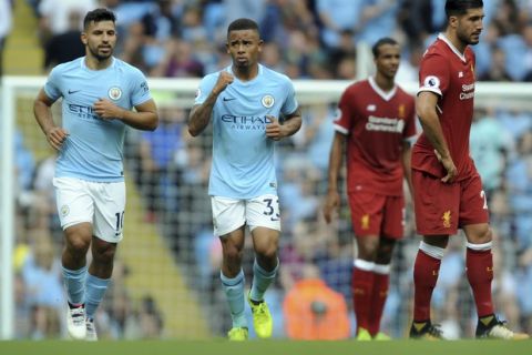 Manchester City's Gabriel Jesus, center, celebrates after scoring his side's 2nd goal during the English Premier League soccer match between Manchester City and Liverpool at the Etihad Stadium in Manchester, England, Saturday, Sept. 9, 2017. (AP Photo/Rui Vieira)