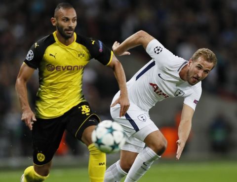 Tottenham's Harry Kane, right, challenges for the ball with Dortmund's Omer Toprak during the Champions League group H soccer match between Tottenham and Borussia Dortmund, at the Wembley stadium in London, Wednesday, Sept. 13, 2017. (AP Photo/Kirsty Wigglesworth)